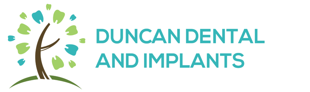 Duncan Dental and Implants" logo featuring a stylized tree with a brown trunk, branching arms, and green and blue leaves. Beside the tree, the clinic's name appears in teal capital letters.